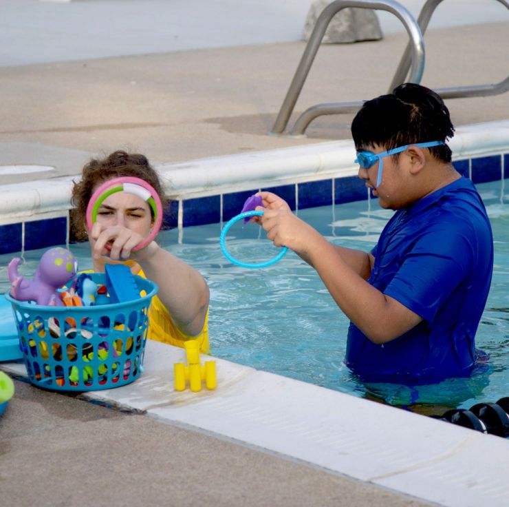 Adaptive swim program swimmer and coach
